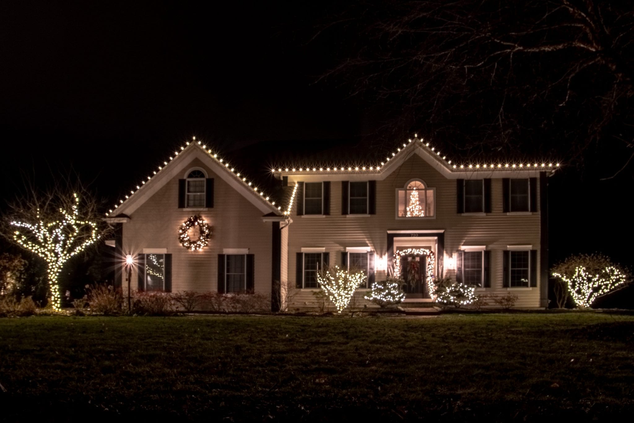 Latham NY home decorated for the holidays with thousands of white led lights